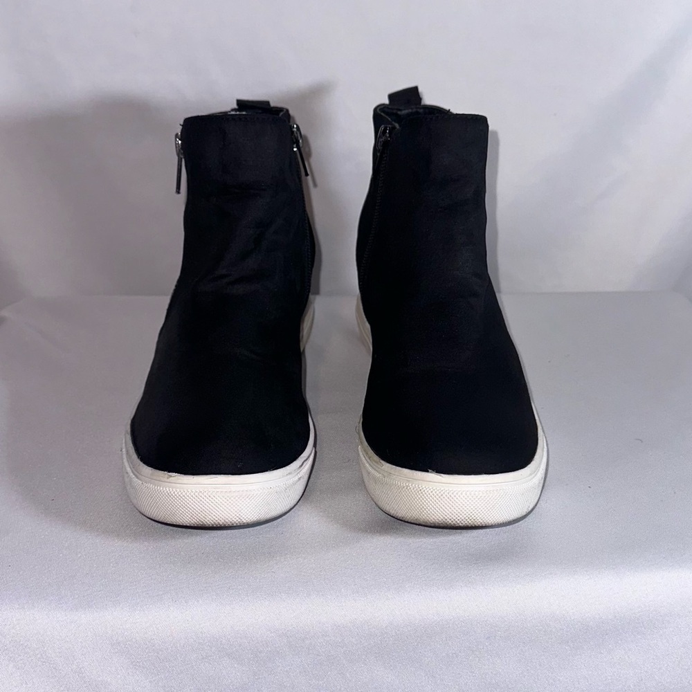 Black suede wedge sneakers.